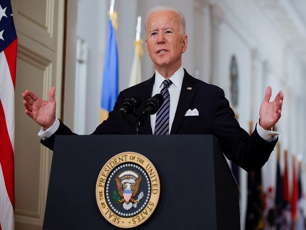 Biden accuses Russia of trying to disrupt 2022 elections