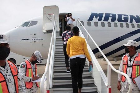 Mexico sends 70 Haitian migrants back home by plane