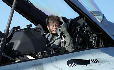Arriving in fighter jet, S.Korea’s Moon urges defence industry growth