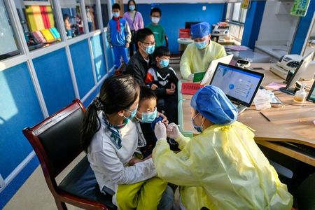 China’s growing COVID-19 outbreak tests vulnerable border towns
