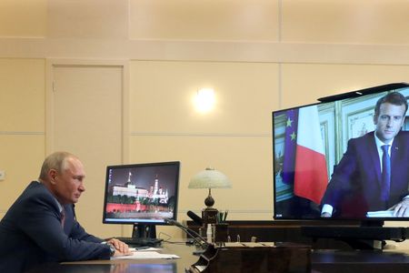 Putin tells Macron he wants talks to curb NATO expansion
