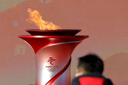 Olympics-Beijing torch begins COVID-shortened relay