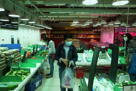 Hong Kong residents raid supermarket shelves as COVID surge disrupts supplies