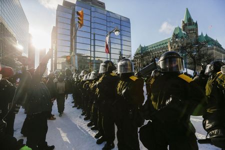 Canadian police arrest dozens to sweep protesters from parliament area
