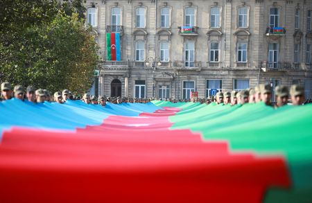 Azerbaijan urges quick peace deal with Armenia but states firm line