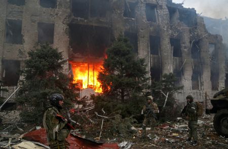 Russia says it will halt hostilities to let civilians leave besieged steel plant on Monday